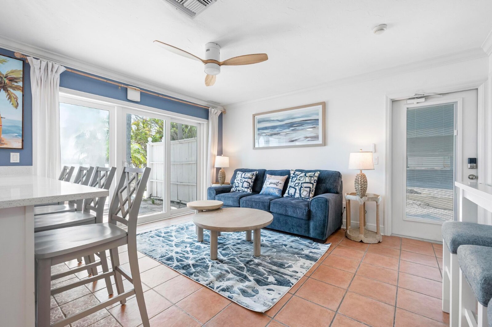 Bright open living room with coastal decor and Smart TV