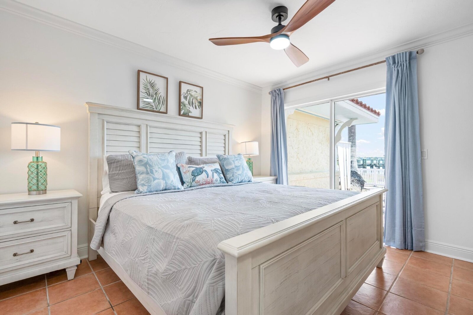 King master suite with grey bedding and ensuite bathroom